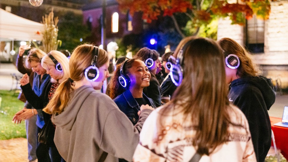 People wear headphones and dance in silent disco
