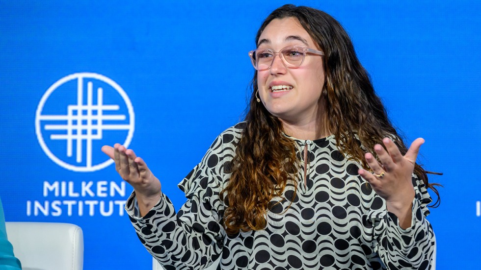 Mia Tretta speaks at a podium