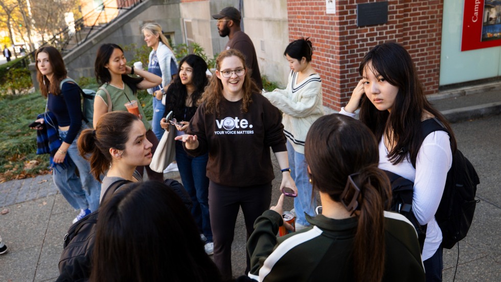 Brown Votes student speaks with a crowd