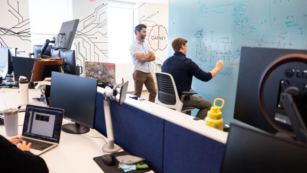 Two people work in lab