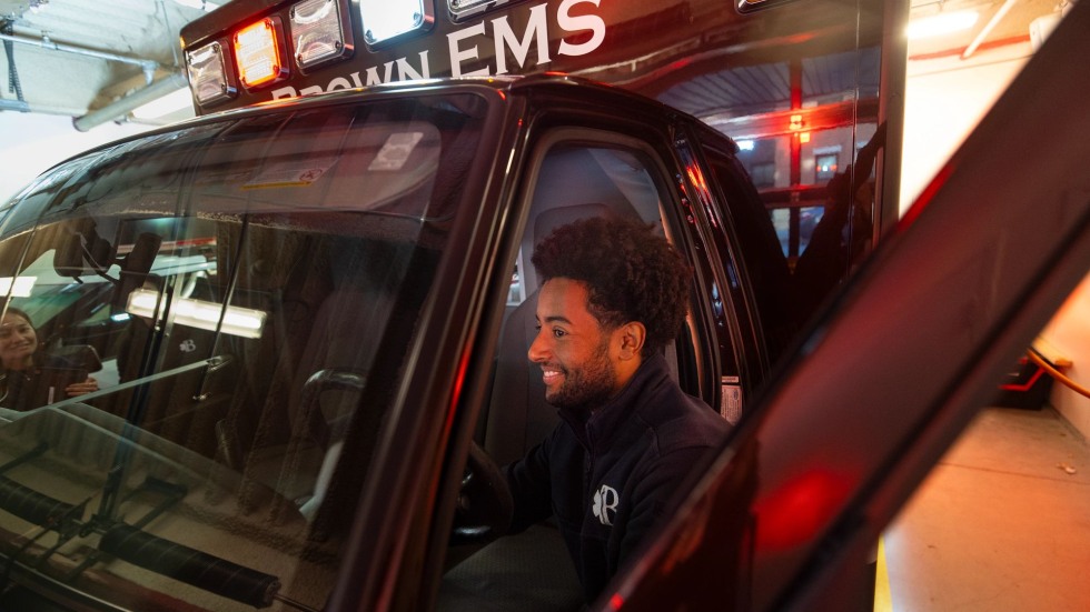 Kanayo Duru climbs into an ambulance