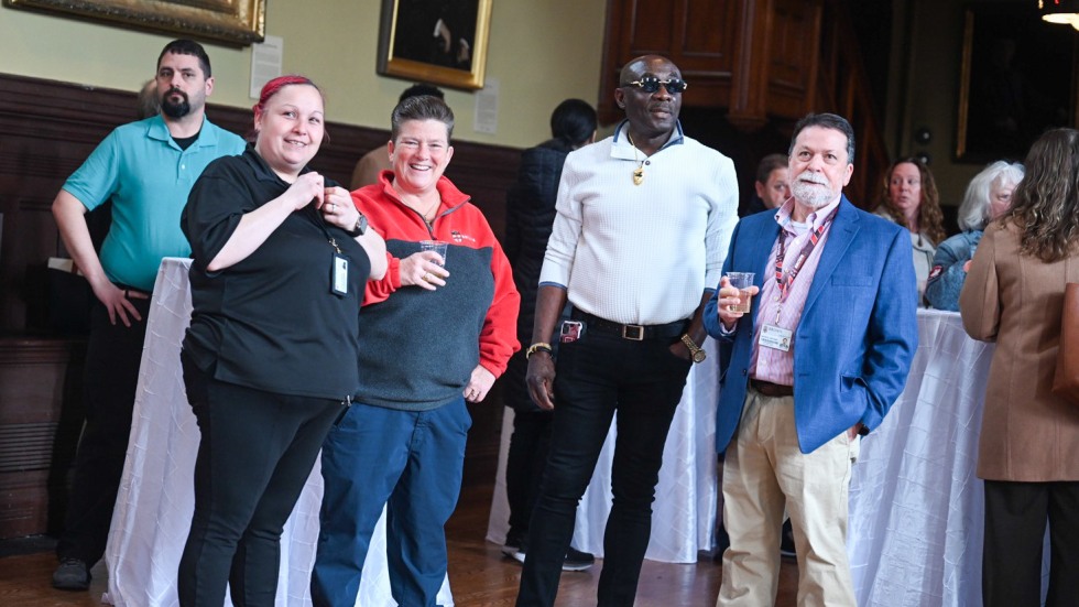 People gather in Sayles Hall