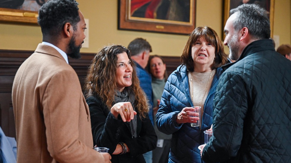four people in conversation