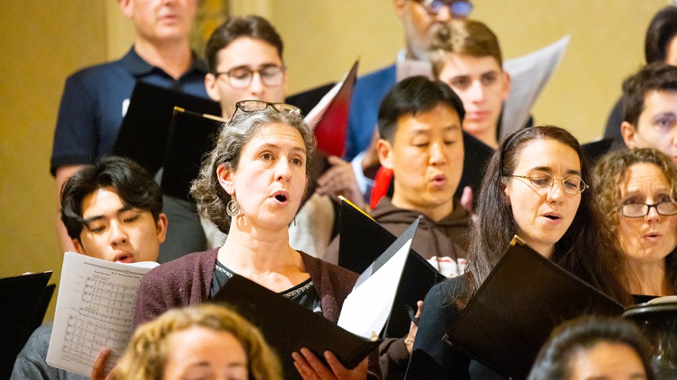 Rebecca Schendel singing with the chorus