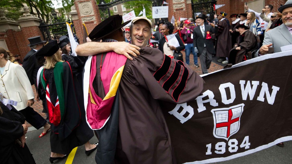 Member of Class of 1984 hugging friend