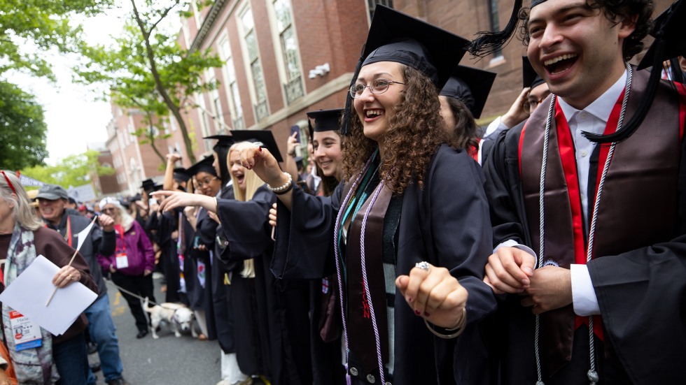 Sofia Barnett, center right, stands in procession
