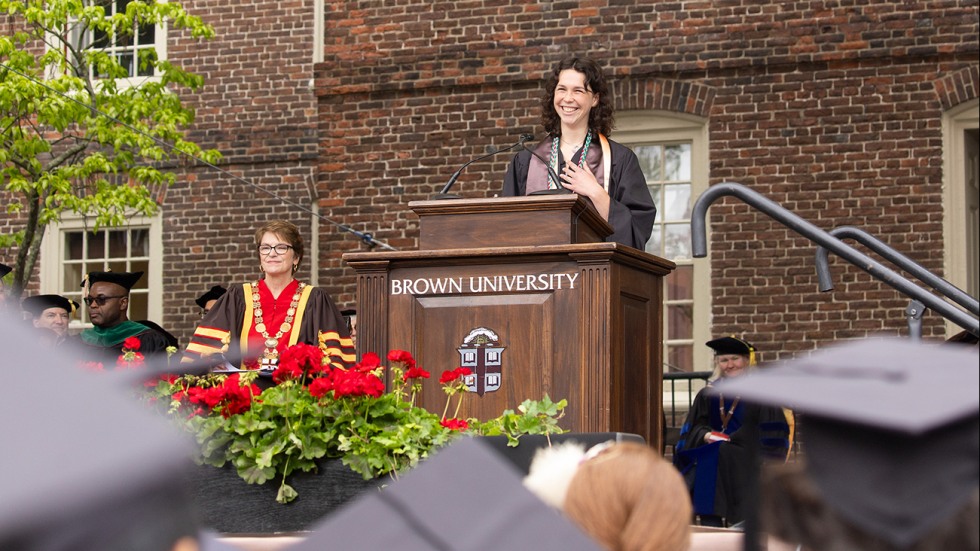 Aliza Kopans speaks at the podium