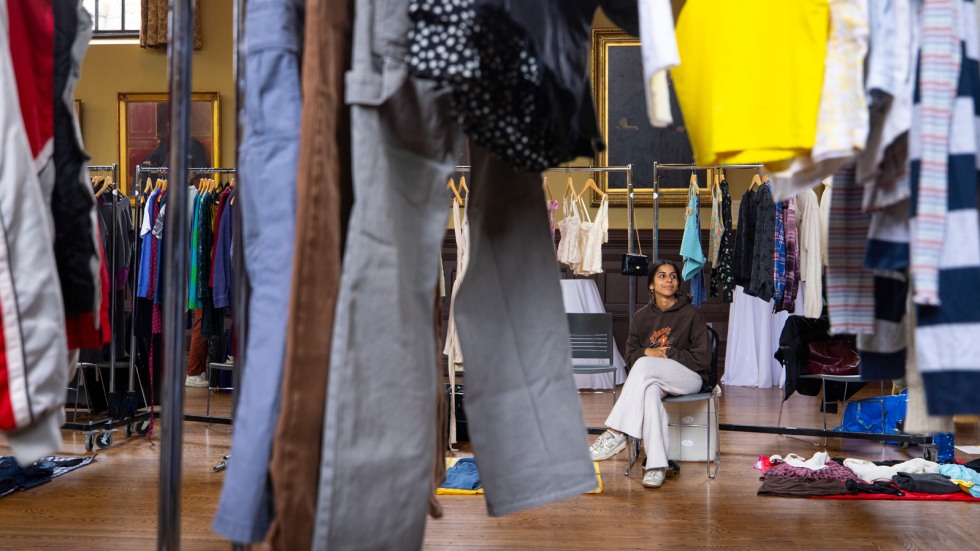 Seller sits near her vendor booth