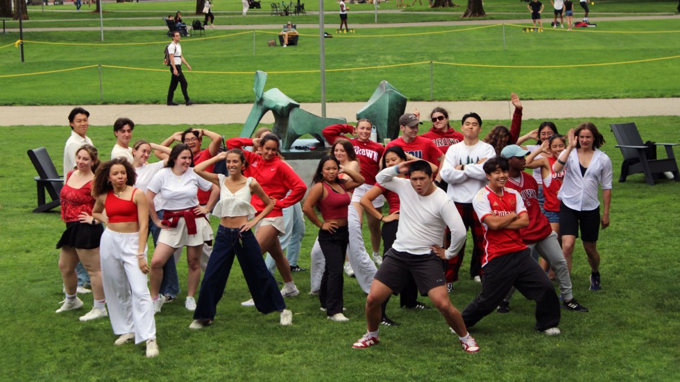 Group strikes a pose during flash mob on College Green