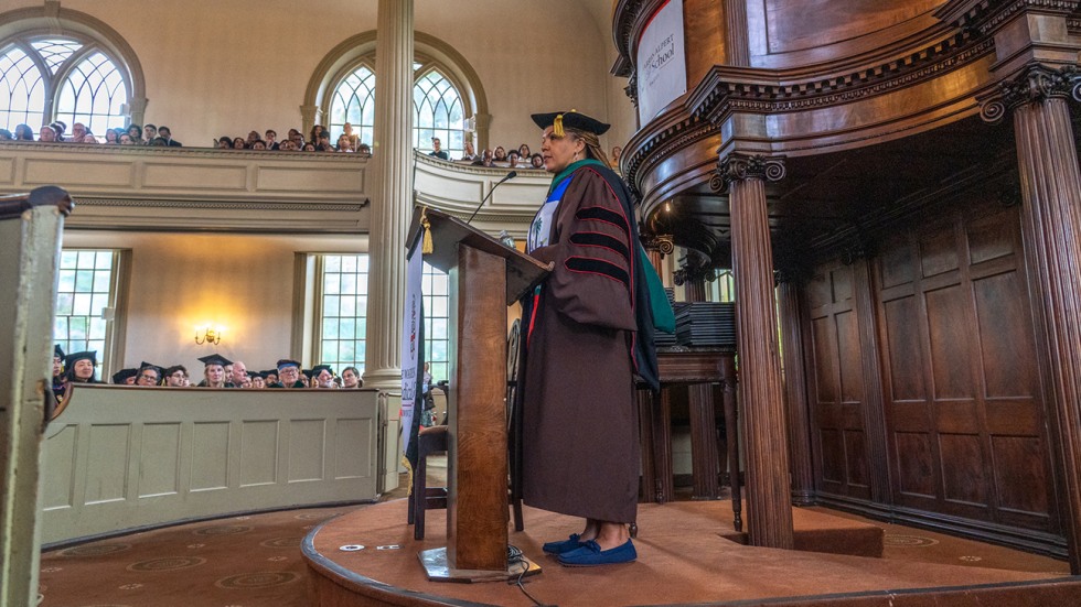 Patricia Poitevien speaks at the podium