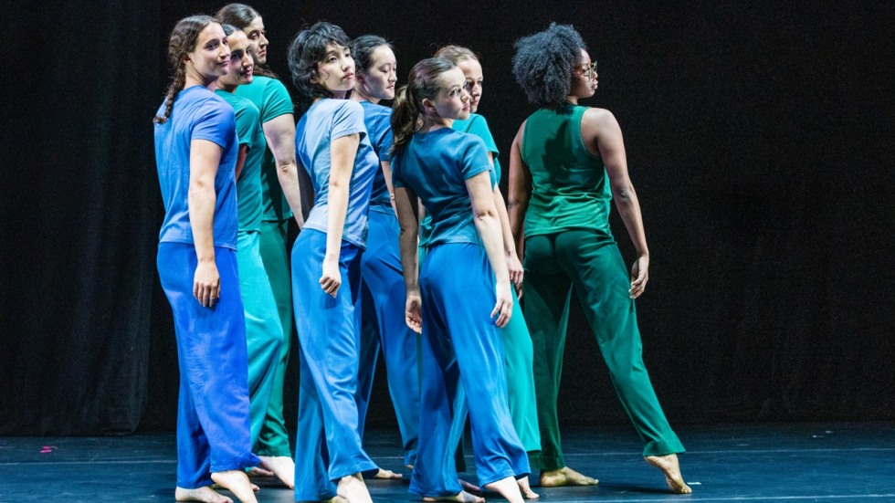 Dancers perform on stage