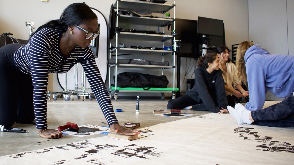 Students creating a mural