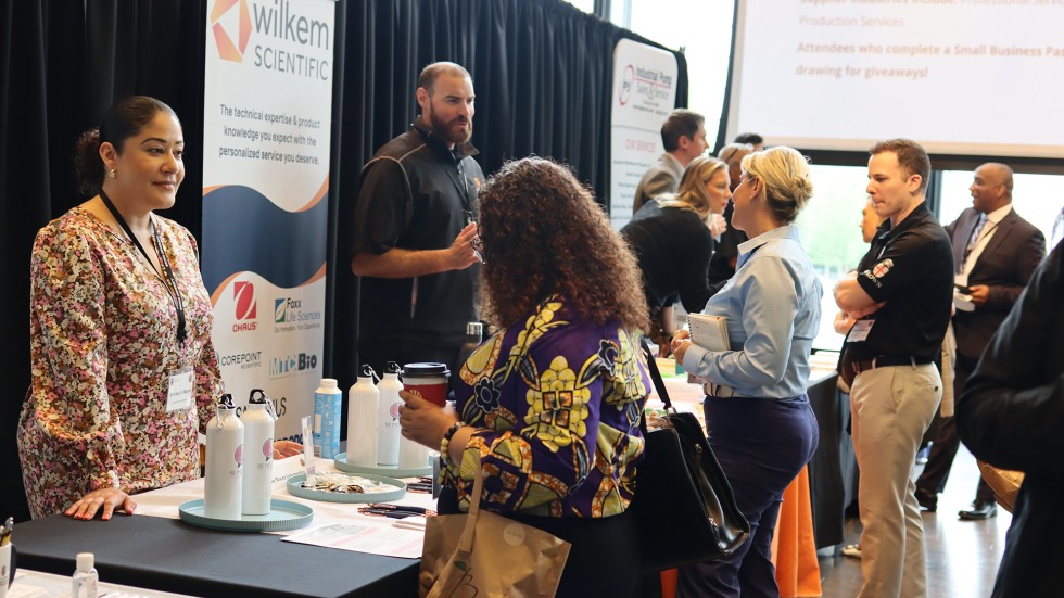 small business owners meet with participants of the summit at the exhibition space in Brown's Granoff Center