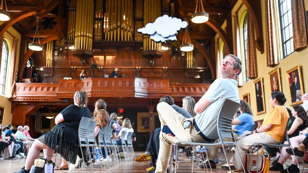 people seated in Sayles Hall