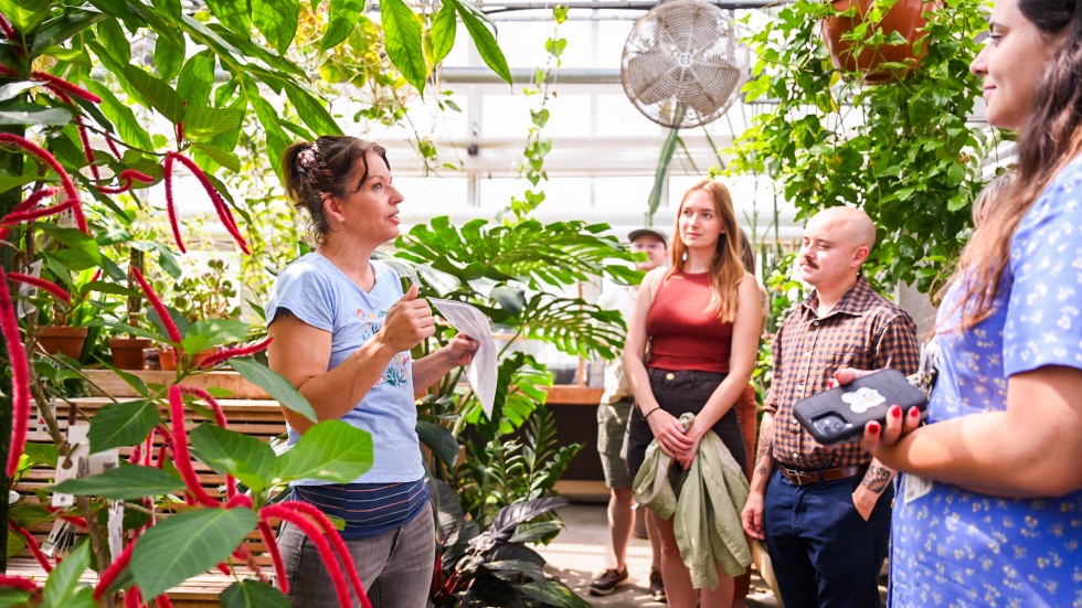 people tour Brown's greenhouse