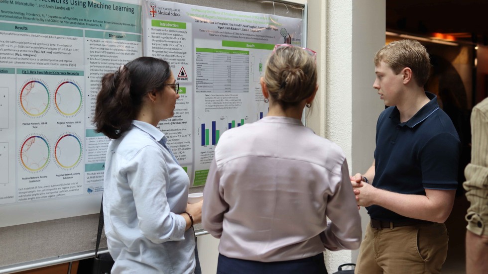 researchers discussing posters