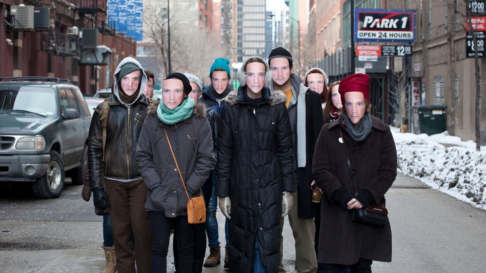 People wear Leo Selvaggio's face as part of his artwork "URME Surveillance" 