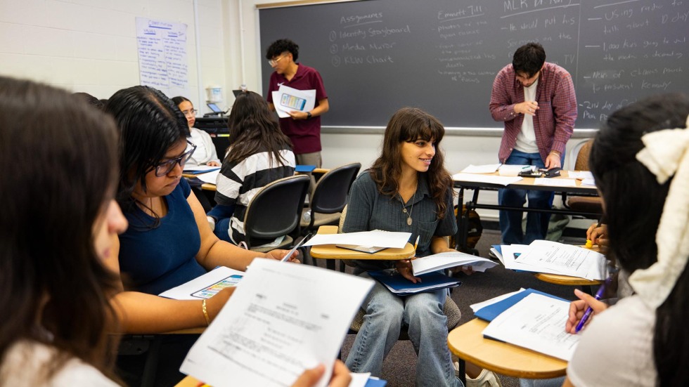 Rhode Island students work together during class, sitting in circles.