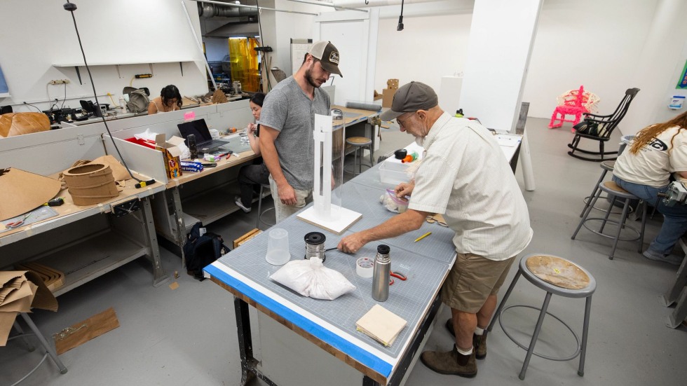 Daniel Stupar and Noah Ward work on a mold