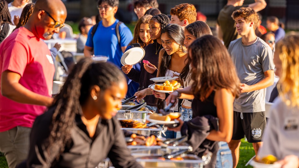 Brown students and local residents line up for buffet of BBQ favorites.