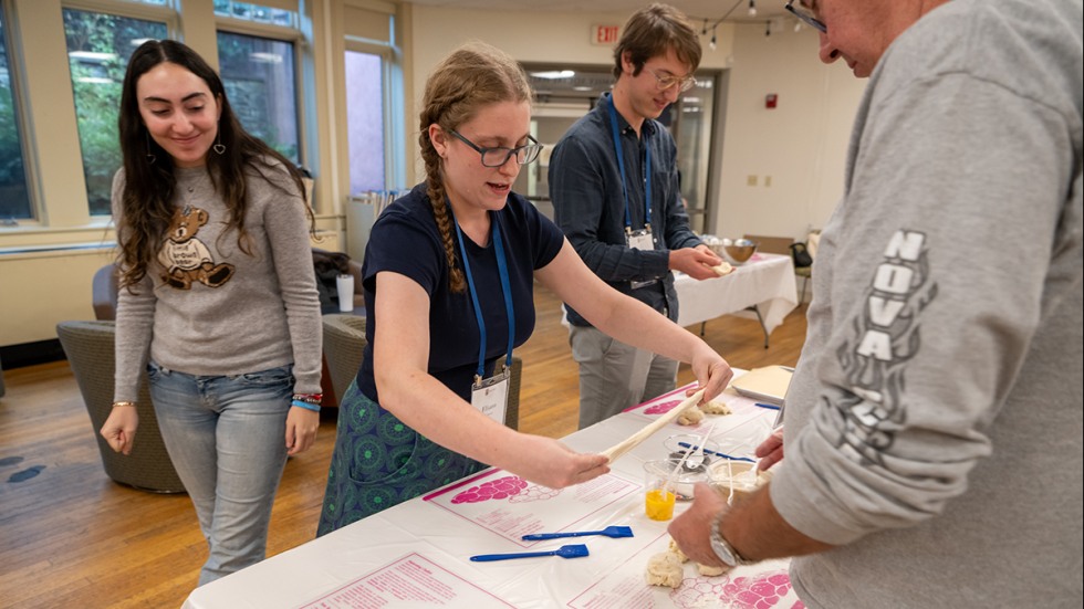 people make challah at a table