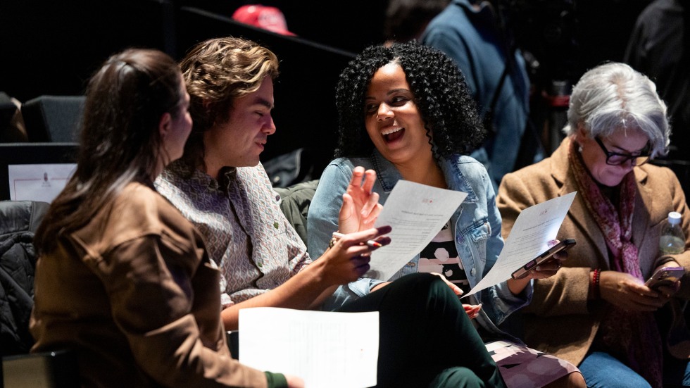 Brown staff members serving as judges discuss each performance between sets for the Battle of the Bands. 