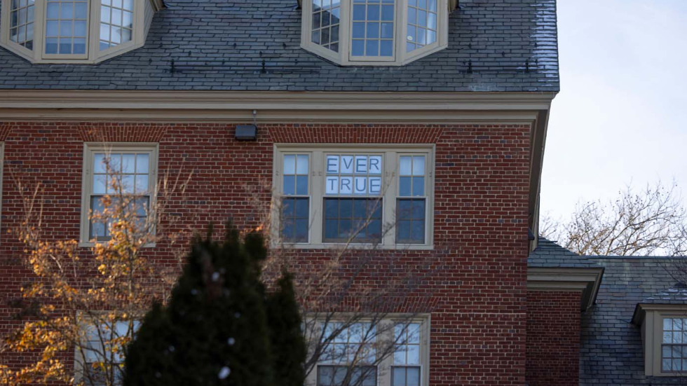 the words EVER TRUE in a window of a building