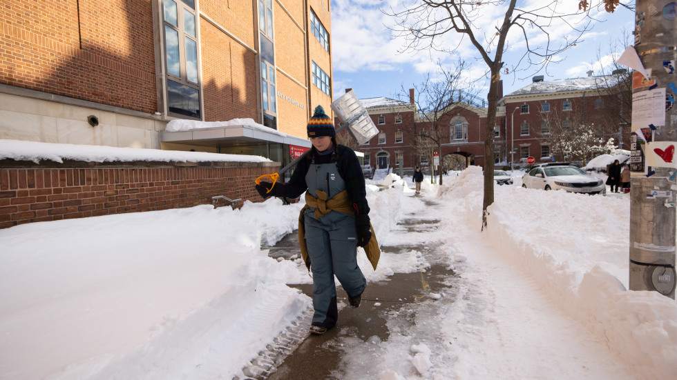 person walking with a shovel