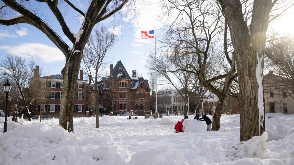 students build snow sculptures on College Green