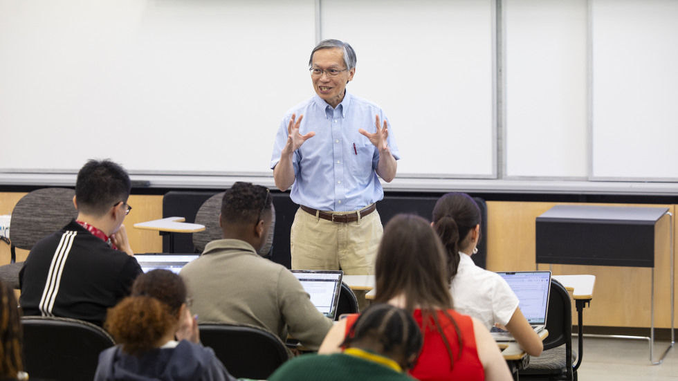 Brown Professor Ken Wong speaks in front on a classroom full of graduate students.