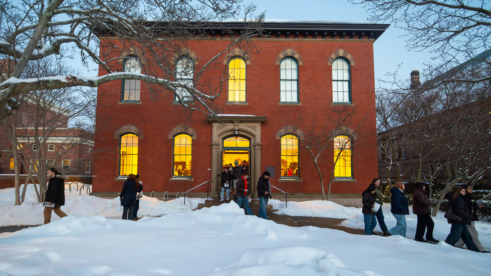 people exit a campus building