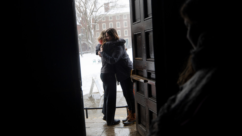 two people hug in doorway