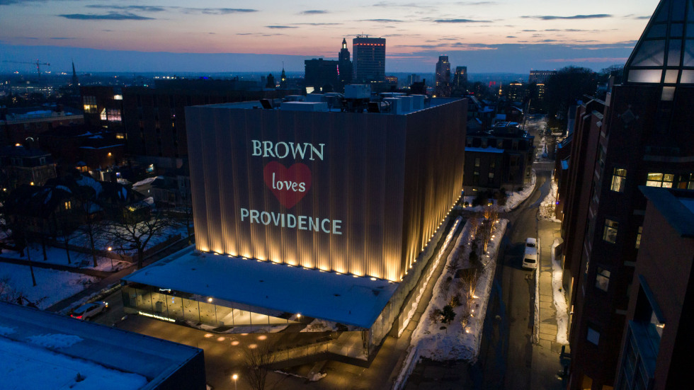 A projection of "Brown Loves Providence" lights up a side of the Lindemann Performing Arts Center.