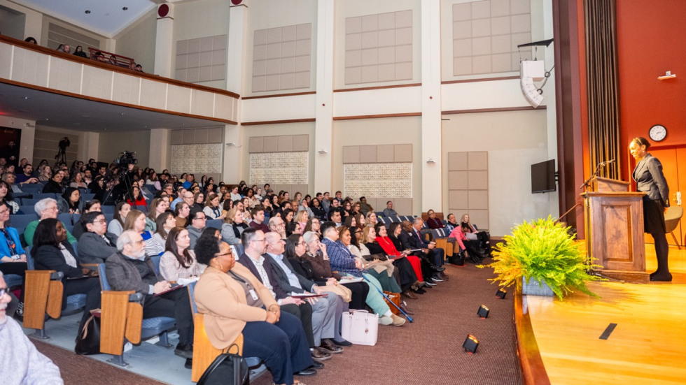 People fill the Salomon Center for Teaching auditorium seats