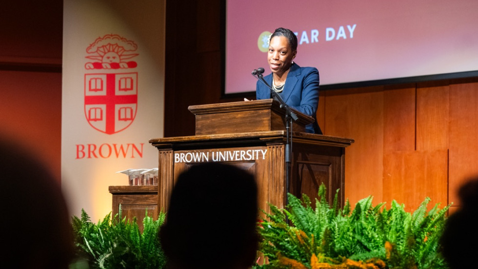 Megan Russell speaks at a podium