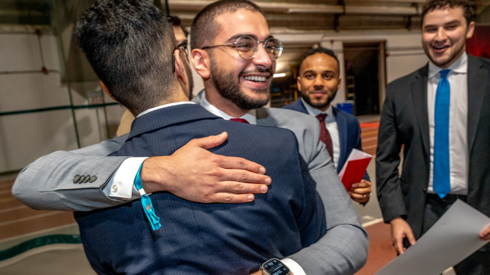 male medical student embracing another male student