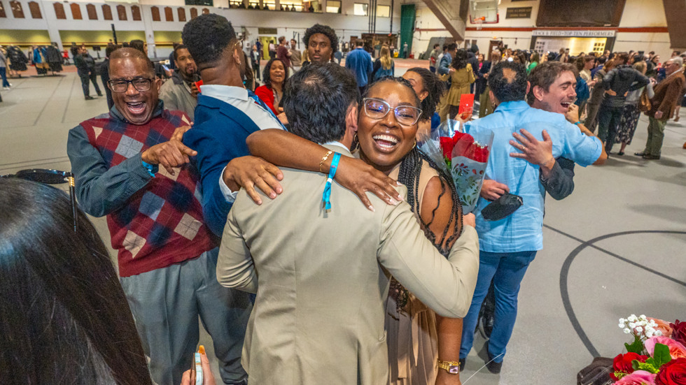 Female medical student surrounded by happy family 