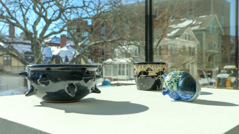 Close-up of three ceramic artworks