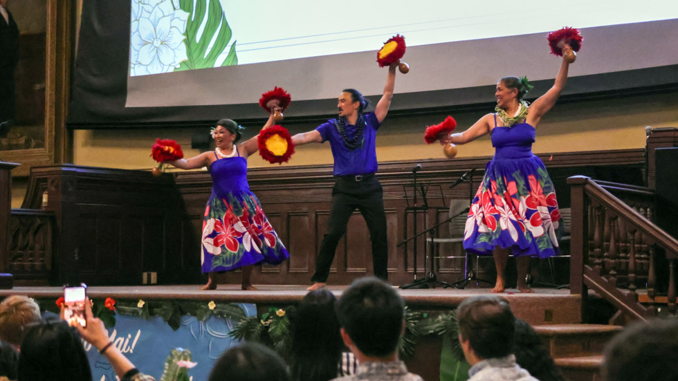 Dancers with a professional hula company perform on stage at Sayles Hall