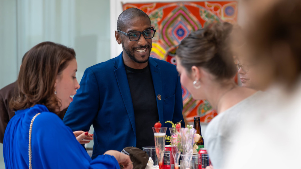 People interacting at reception 