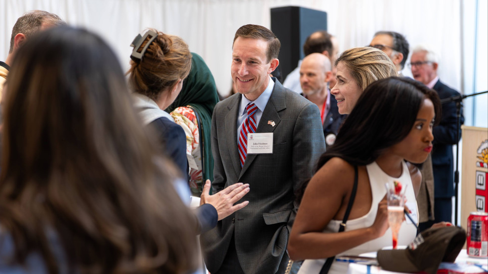 John Friedman interacting with students and alumni 