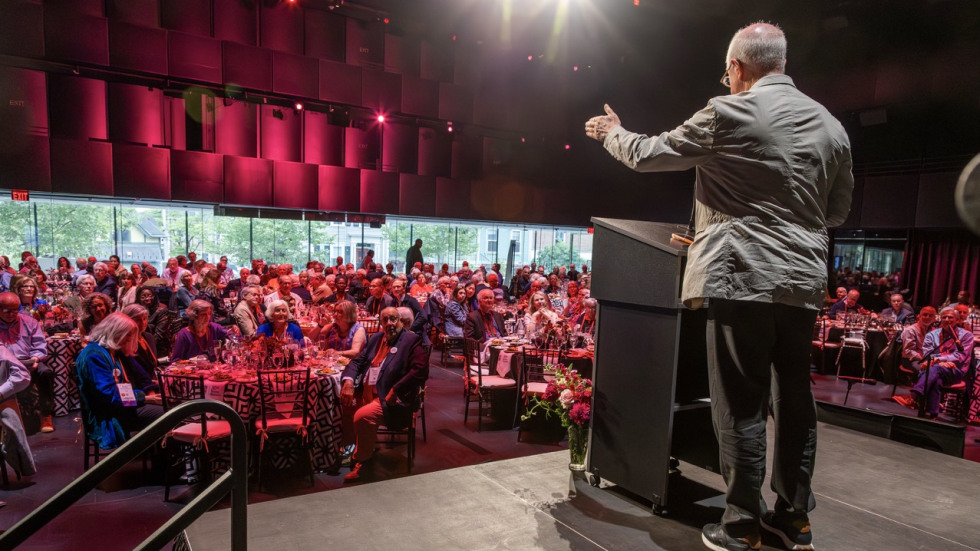 Thomas Tisch speaks from the stage to his Brown classmates