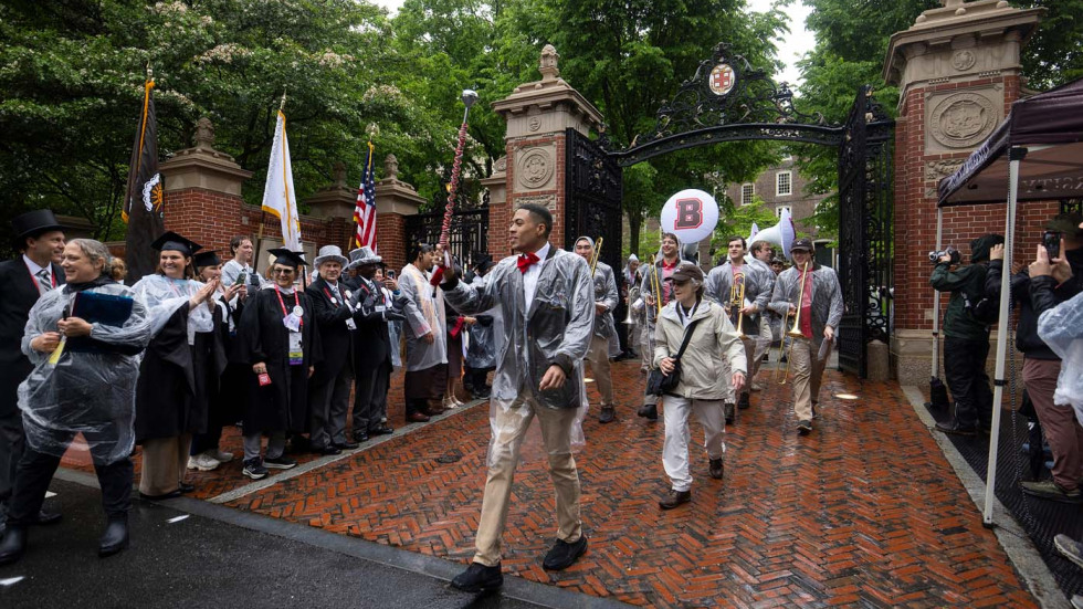 marching band members walking through gates