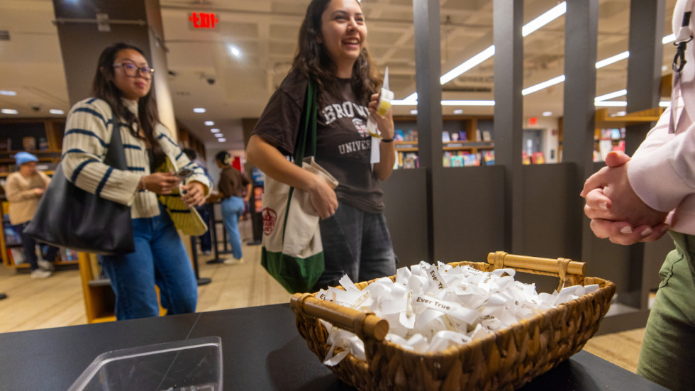 Students line up in the bookstore, with a basket of EverTrue ribbons in the foreground