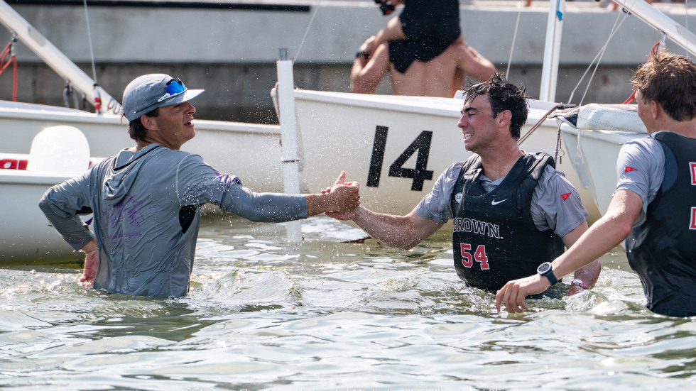 Sailors celebrate in the water