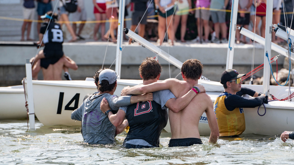 Sailors celebrate in the water after winning championship