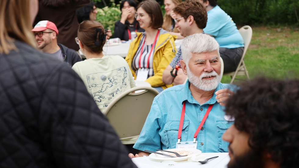 man sitting at outdoor table