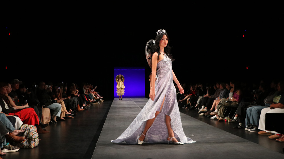 student poses in dress 