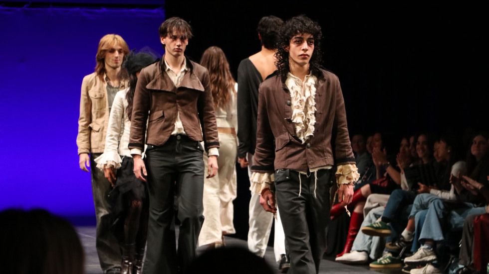 students posing on runway