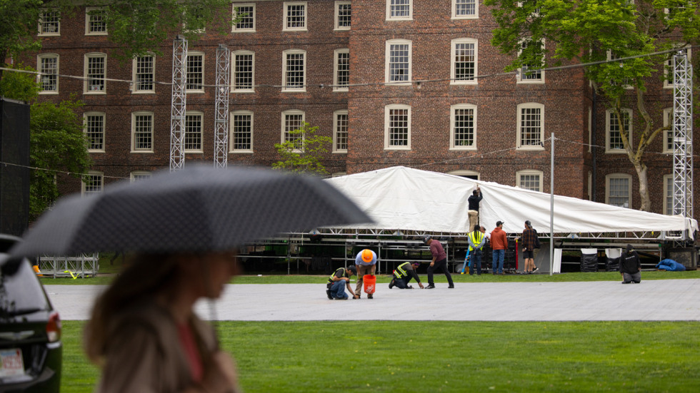 Workers set up the main stage on the College Green